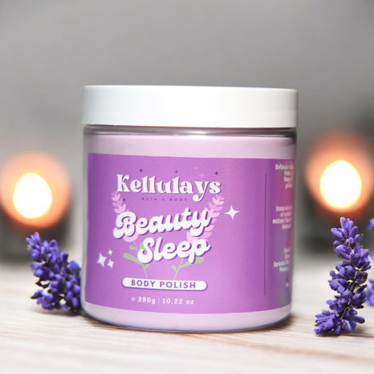 Jar of Kellulays Beauty Sleep Body Polish with a lavender-themed label, surrounded by sprigs of lavender and soft candlelight in the background, creating a calming and soothing atmosphere.