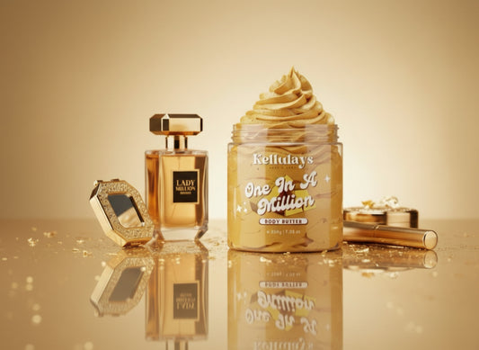 A luxurious jar of Kellulays One In A Million body butter with a gold whipped swirl, styled alongside a Lady Million perfume bottle and gold beauty accessories on a reflective golden surface. The setup highlights the perfume-dupe fragrance and premium, high end aesthetic.