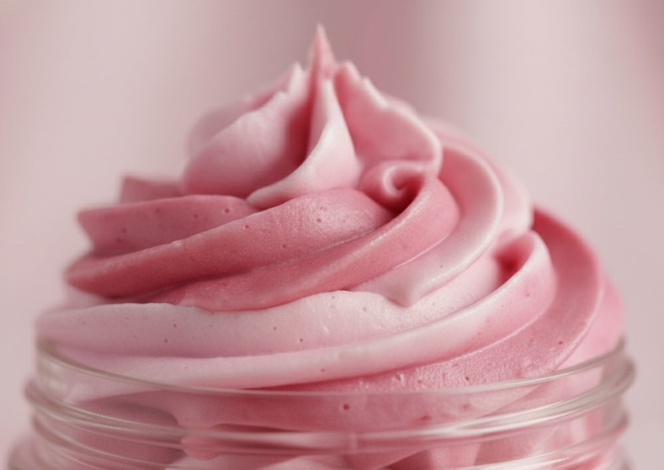 A close-up view of the whipped swirl texture of Kellulays Rose Quartz, featuring soft pink and rose-toned layers with a smooth, creamy finish. The detailed macro shot highlights the fluffy, luxurious consistency and the dreamy pastel pink aesthetic.