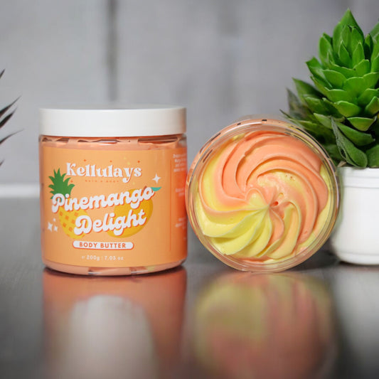 Two jars of Kellulays Pinemango Delight Whipped Body Butter, featuring vibrant yellow and orange swirls, showcasing the luxurious and tropical aesthetic of the handmade body butter.