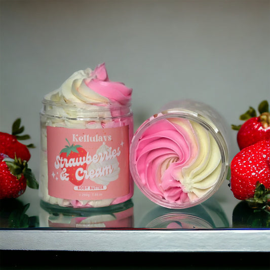Pink and white swirls of Kellulays strawberries and cream whipped body butter in a jar, offering a luxurious and nourishing skincare treat with a delightful scent.