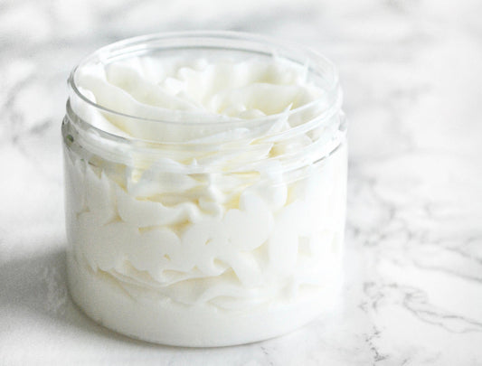 Vanilla Sandalwood Whipped Body Butter in a jar, showcasing its creamy texture and luxurious formulation. Enriched with nourishing ingredients for deep hydration and a soothing vanilla and sandalwood scent.