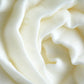 Close-up of Vanilla Sandalwood Whipped Body Butter in a jar, highlighting its rich, creamy consistency. Formulated with moisturising ingredients to provide soft, smooth skin with a warm, calming fragrance.